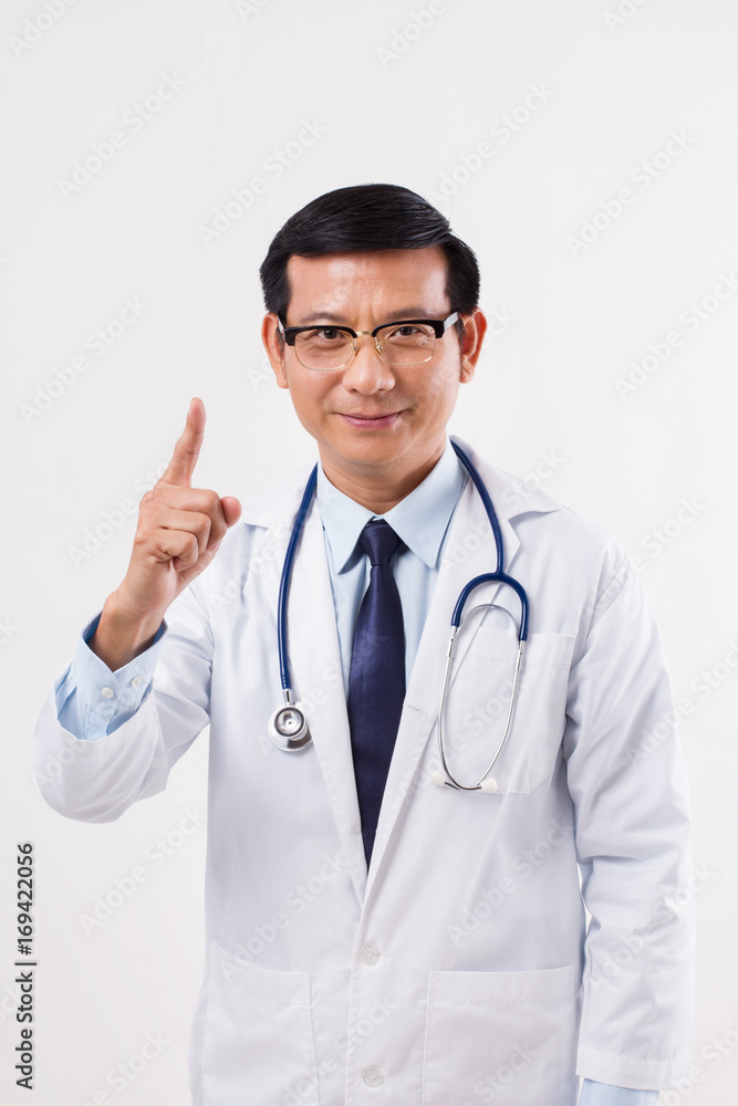 confident doctor pointing up, suggesting something confident doctor pointing up, suggesting something