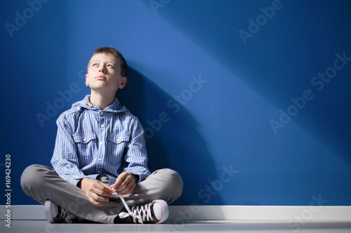 Thoughtful autistic boy photo