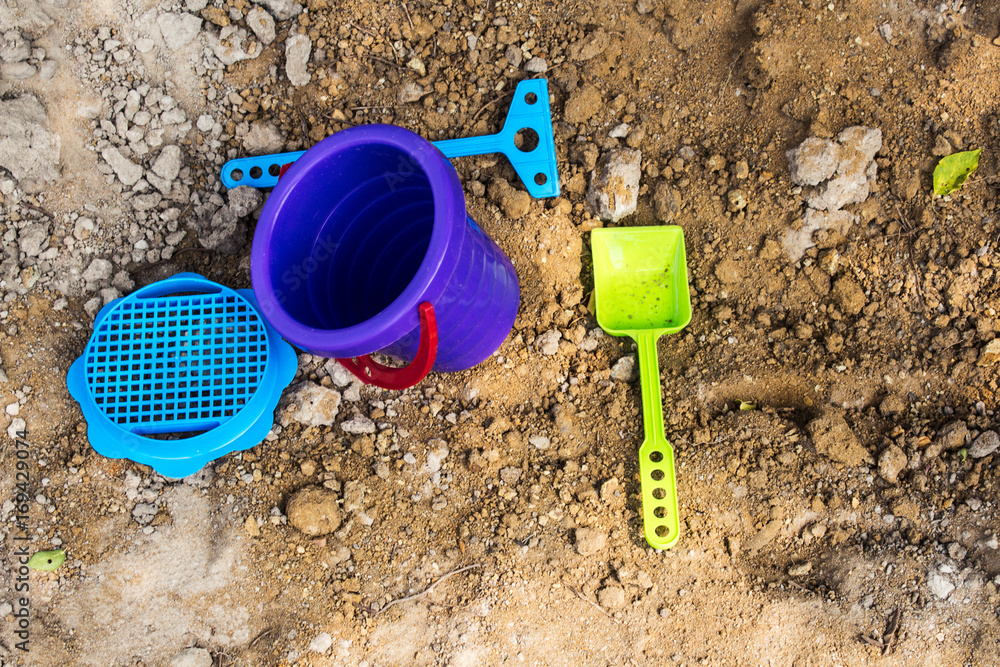 Baby bucket and shovel in the sandbox Baby bucket and shovel in the sandbox