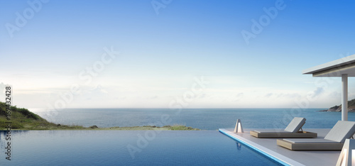 Luxury beach house with sea view swimming pool and terrace in modern design, Lounge chairs on wooden deck at vacation home or hotel - 3d illustration of residential building