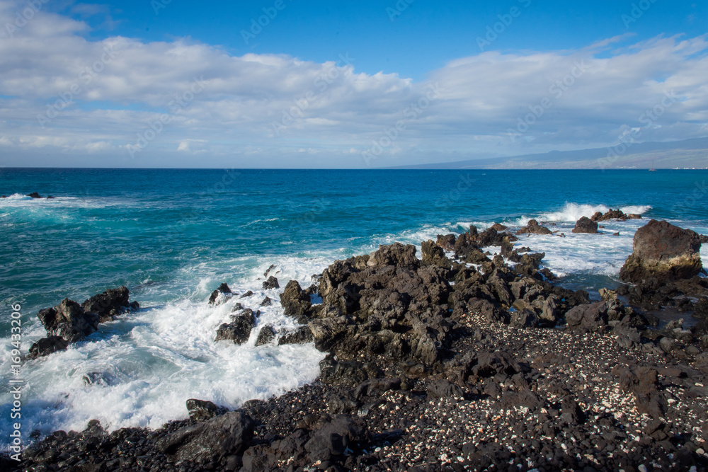 Hawaii waves crashing on rocks
