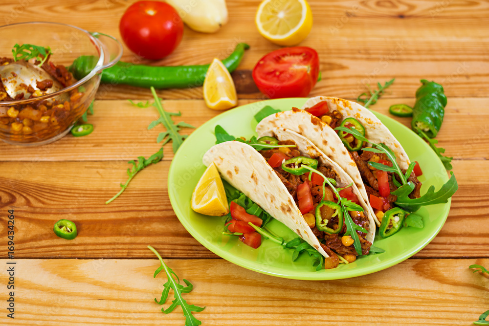 Mexican tacos with beef in tomato sauce Mexican tacos with beef in tomato sauce