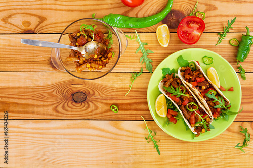 Mexican tacos with beef in tomato sauce