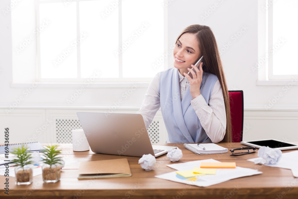 Business talk, woman consulting by phone at office Business talk, woman consulting by phone at office