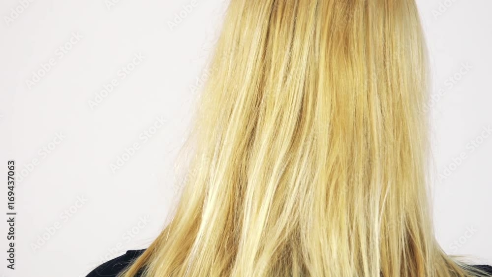 Closeup on the back of the head of a blonde woman - white screen studio Closeup on the back of the head of a blonde woman - white screen studio