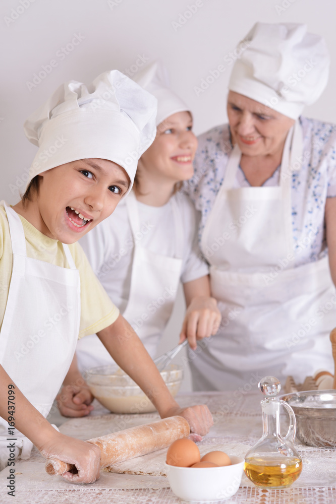 Grandmother and grandsons cooking together Grandmother and grandsons cooking together