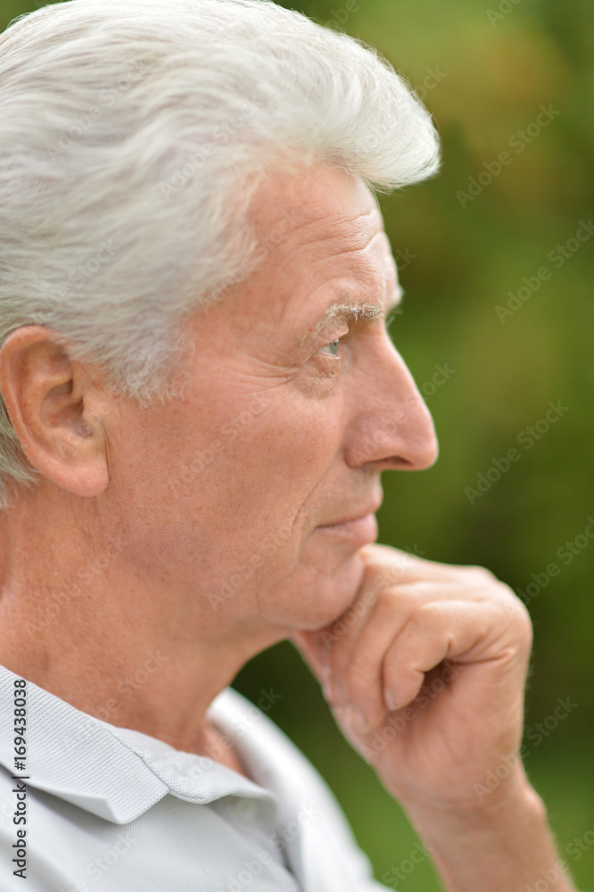 Serious senior man thinking in park Serious senior man thinking in park