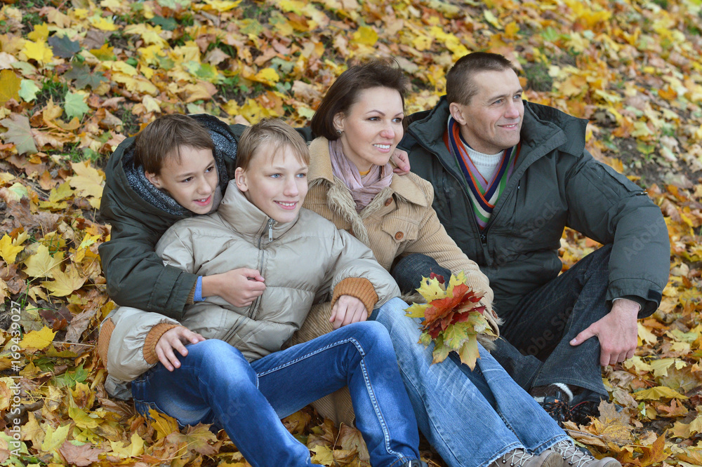 Happy family in autumn forest Happy family in autumn forest