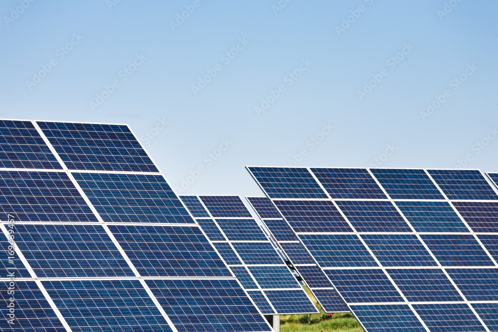 Solar panels against blue sky background Solar panels against blue sky background