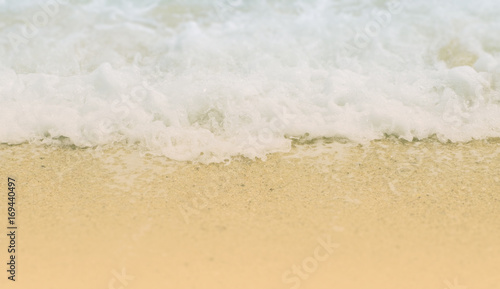 Wave on sand with tilt shift effect selective focused on wave