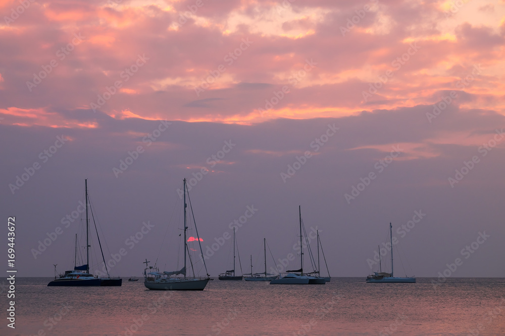 Sailboats and sunset at Nai Harn beach, Phuket, Thailand. Sailboats and sunset at Nai Harn beach, Phuket, Thailand.
