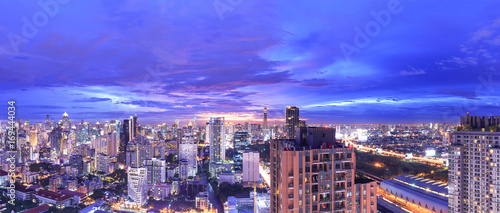 panoramic view of modern city skyline at twilight, long exposure photography