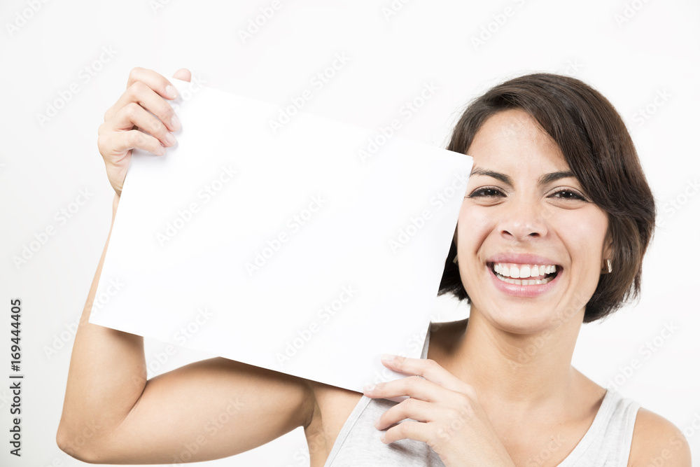 Beautiful young woman holding a blank sheet of paper Beautiful young woman holding a blank sheet of paper