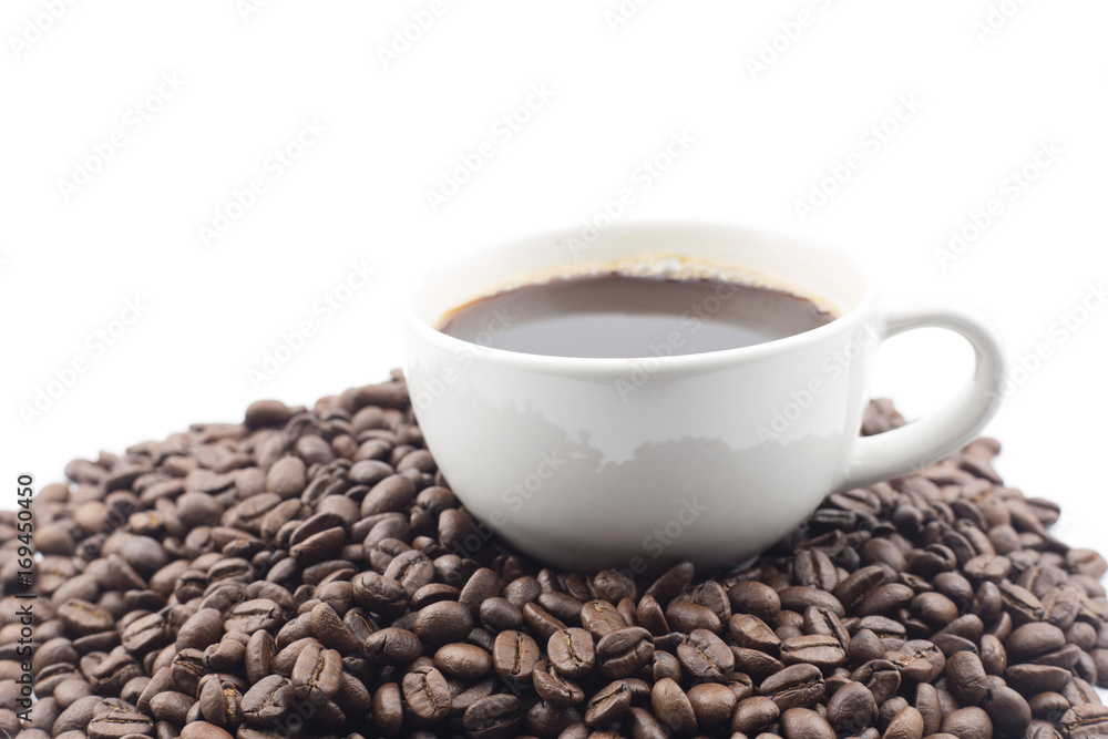 Coffee cup and beans on a white background. Coffee cup and beans on a white background.