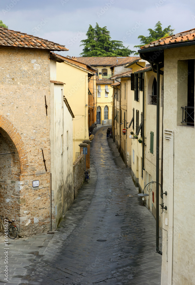Winding tiled street in Lucca, Italy, 2017.
