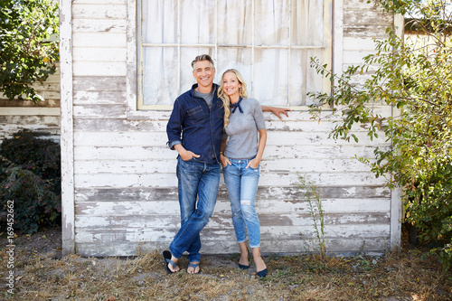 Portrait of mature couple at farmhouse