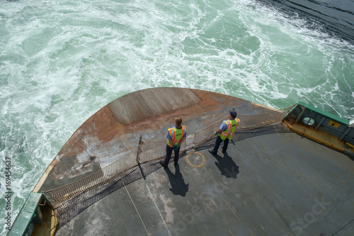 Deck hands on ferry boat photo