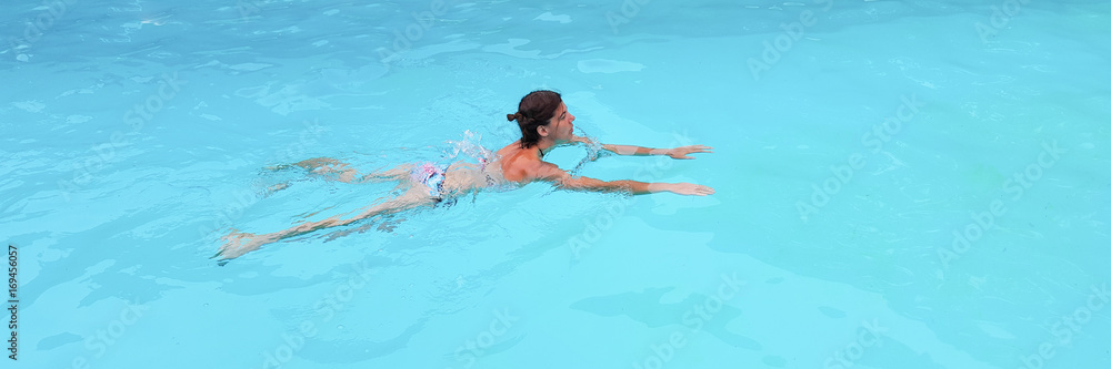 forties woman in the swimming pool