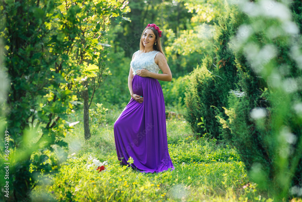 Beautiful pregnant woman in the park Beautiful pregnant woman in the park