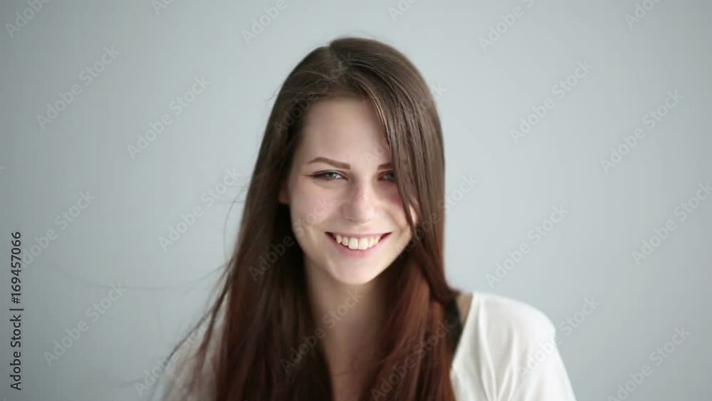Portrait of a beautiful girl in the studio on a gray background Portrait of a beautiful girl in the studio on a gray background