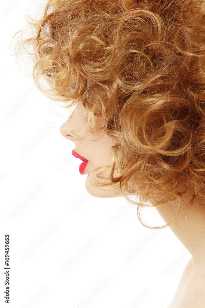 Profile of woman with curly hair over white background, copy space Profile of woman with curly hair over white background, copy space