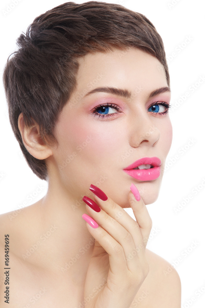 Beautiful woman with short hair cut, pink make-up and fancy manicure over white background, copy space Beautiful woman with short hair cut, pink make-up and fancy manicure over white background, copy space