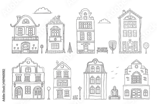 Set of contour houses on white . Vector doodles .