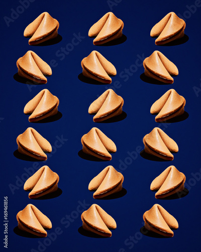 Fortune Cookies in Repeating Pattern on Dark Blue Background