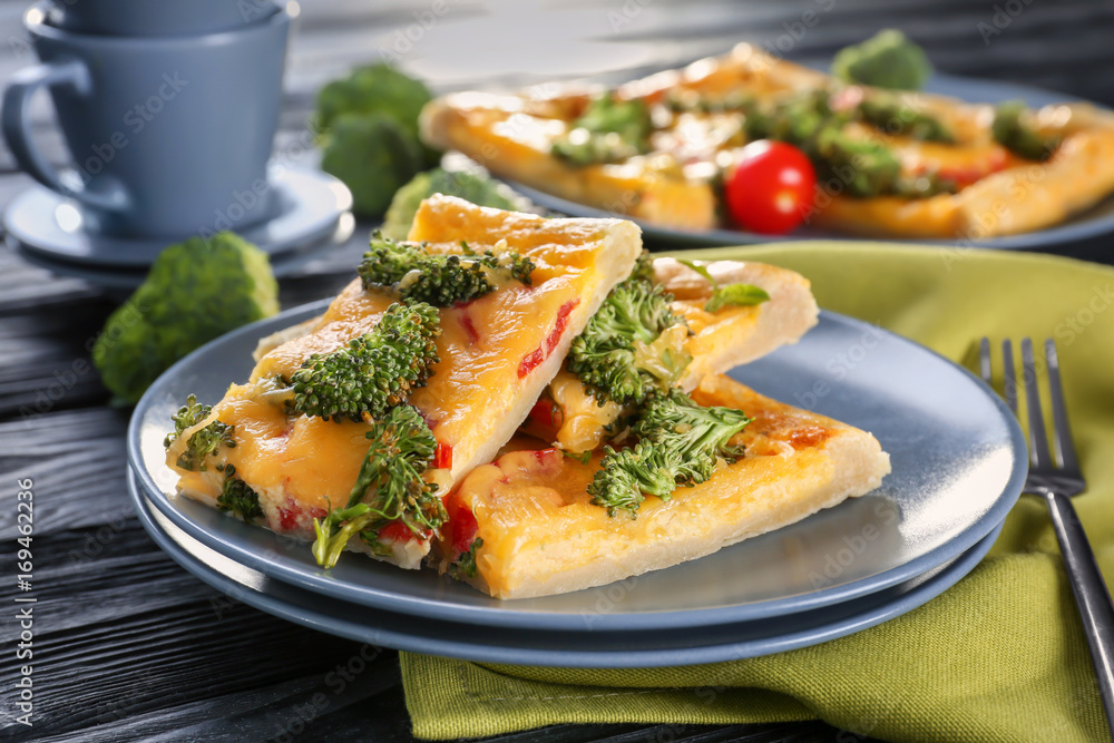 Traditional quiche with broccoli and cheese on plate Traditional quiche with broccoli and cheese on plate