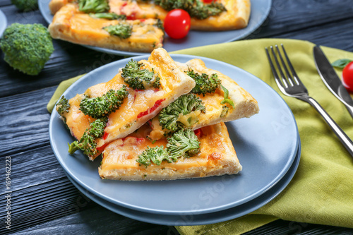 Traditional quiche with broccoli and cheese on plate