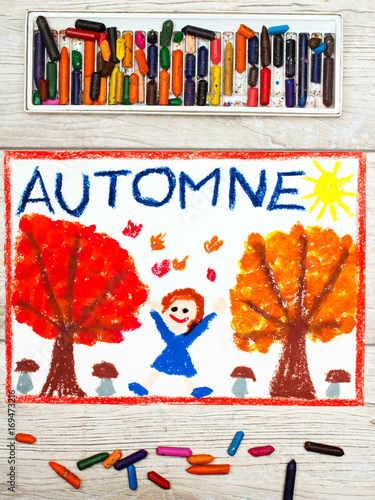 Photo of colorful drawing: French word Autumn, happy girl, trees with orange and red leaves and muschrooms,