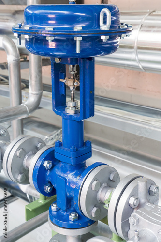 Slika na platnu Pneumatic control valve in a steam heating system