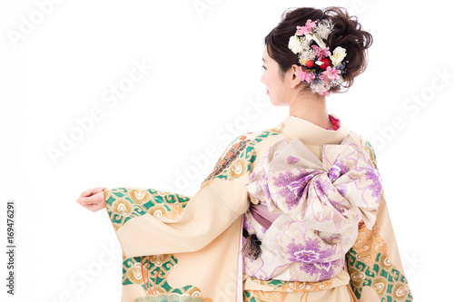 portrait of young asian woman wearing traditional kimono isolated on white background