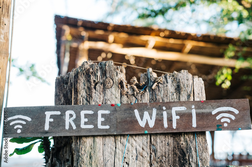 'Free Wifi' hand written on a wooden sign in Bali. photo