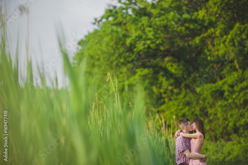 young couple in love together on nature in summer © Ryzhkov Oleksandr