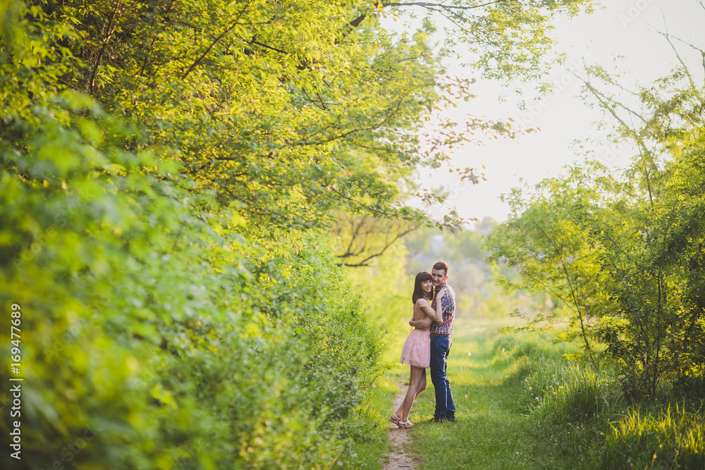 young couple in love together on nature