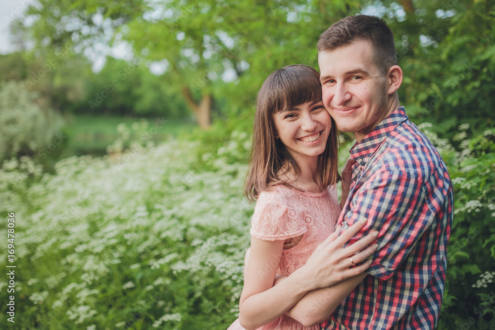 young couple in love together on nature young couple in love together on nature