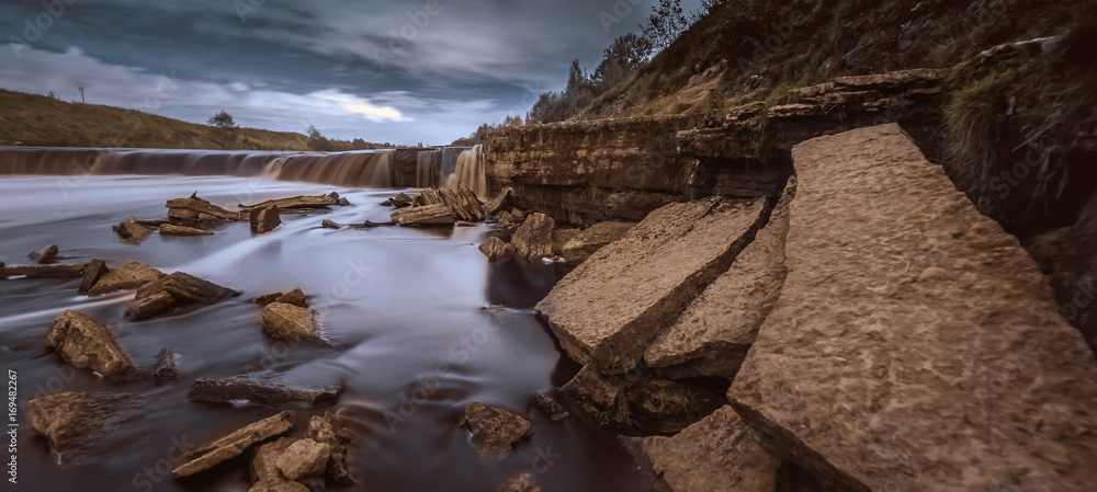 Waterfall at night. Panorama of a night waterfall.