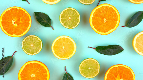 Schilderij op canvas Mixed citrus fruit on aqua blue table