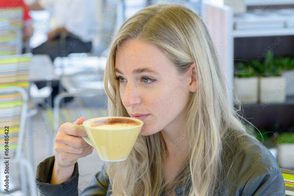 Young blond woman drinking coffee Young blond woman drinking coffee