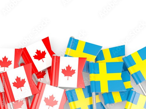 Flag pins of Canada and Sweden isolated on white. 3D illustration