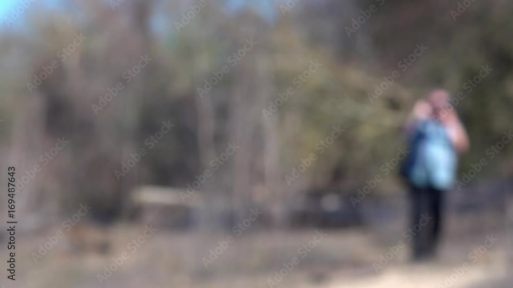 Blurred focus man taking photos on smartphone Blurred focus man taking photos on smartphone