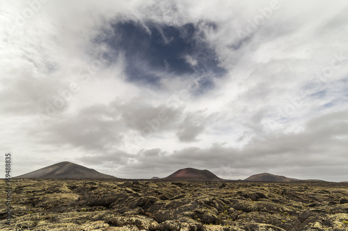 Nervous clouds on the Fire Mountains, Timanfaya National Park, Lanzarote, Canary Islands, Spain