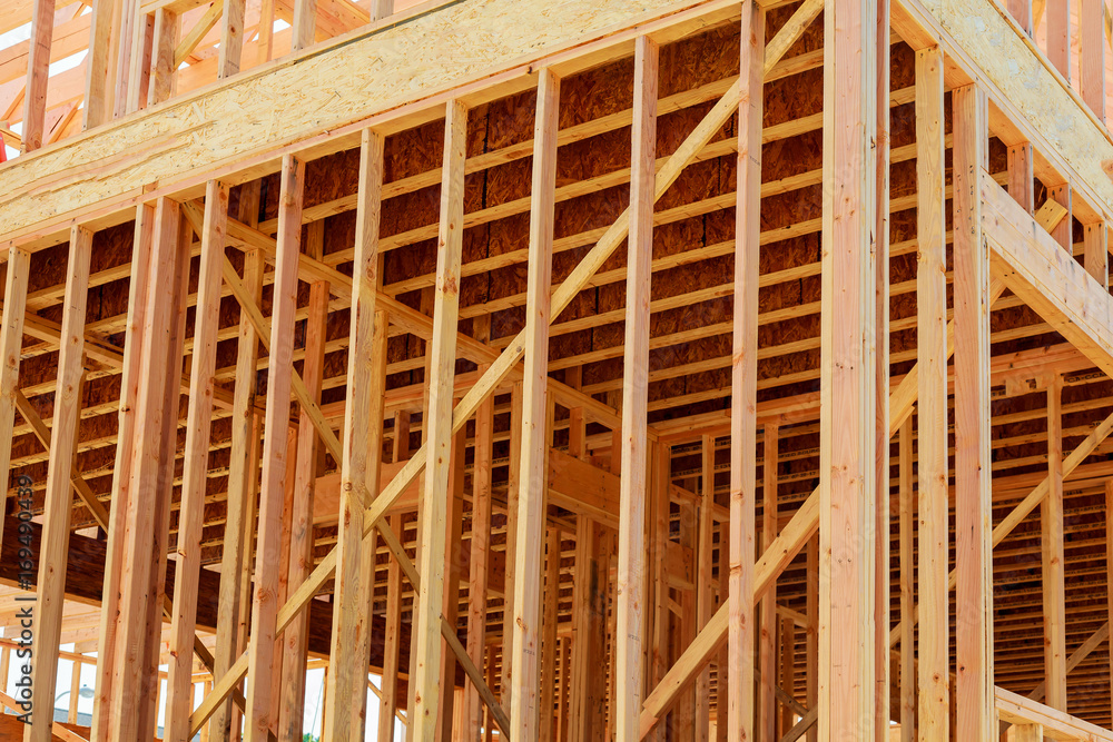 wood framework of new residential home under construction. wood framework of new residential home under construction.