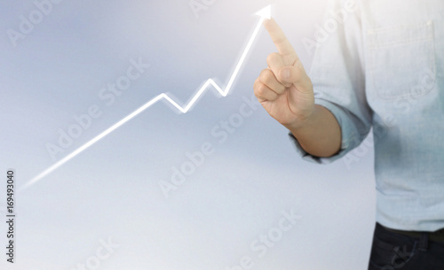  Businessman plan growth and increase of chart positive indicators in his business