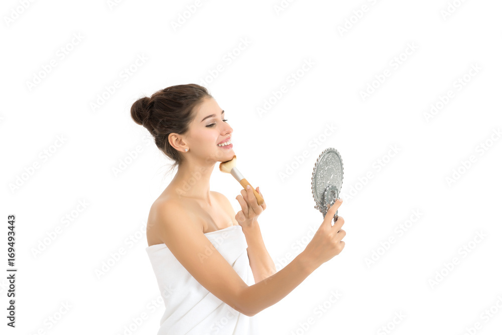 Attractive woman holding and looking at mirror isolated on white. Attractive woman holding and looking at mirror isolated on white.