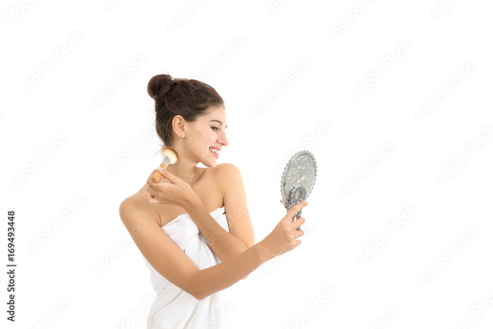 Attractive woman holding and looking at mirror isolated on white. Attractive woman holding and looking at mirror isolated on white.