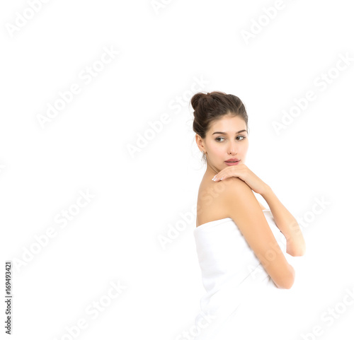 Beautiful spa woman showing perfect skin with copy space isolated on white.