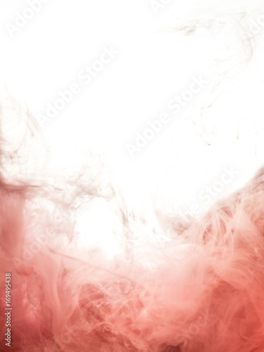 Ink swirl in water isolated on white background. The paint in the water. Soft dissemination a droplets of pink ink in water close-up. Abstract background. Explosion of splashes yellow acrylic ink.