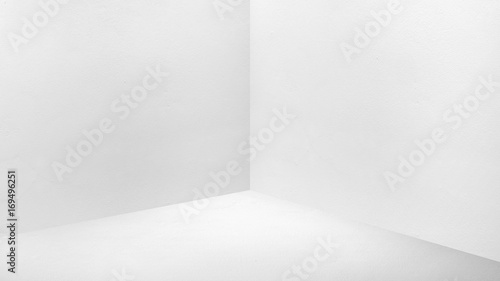 Empty corner white concrete wall and  floor perspective room,Modern style room,Mock up for display of product,business presentation photo